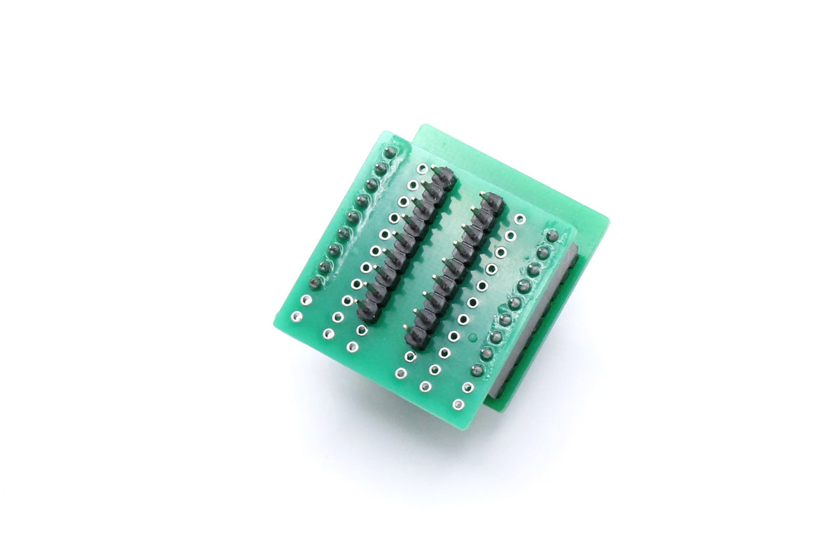Underside of the SOT23-6 to DIP programming socket adapter showing two rows of pins