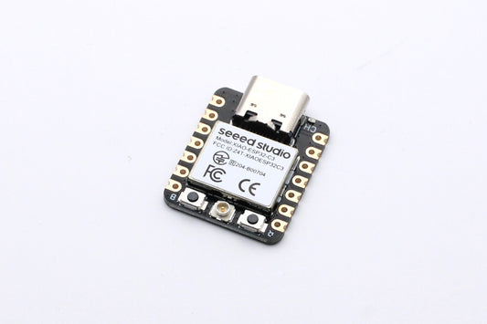 Seeed Studio XIAO ESP32-C3 board, front view with USB-C connector and unsoldered header holes.